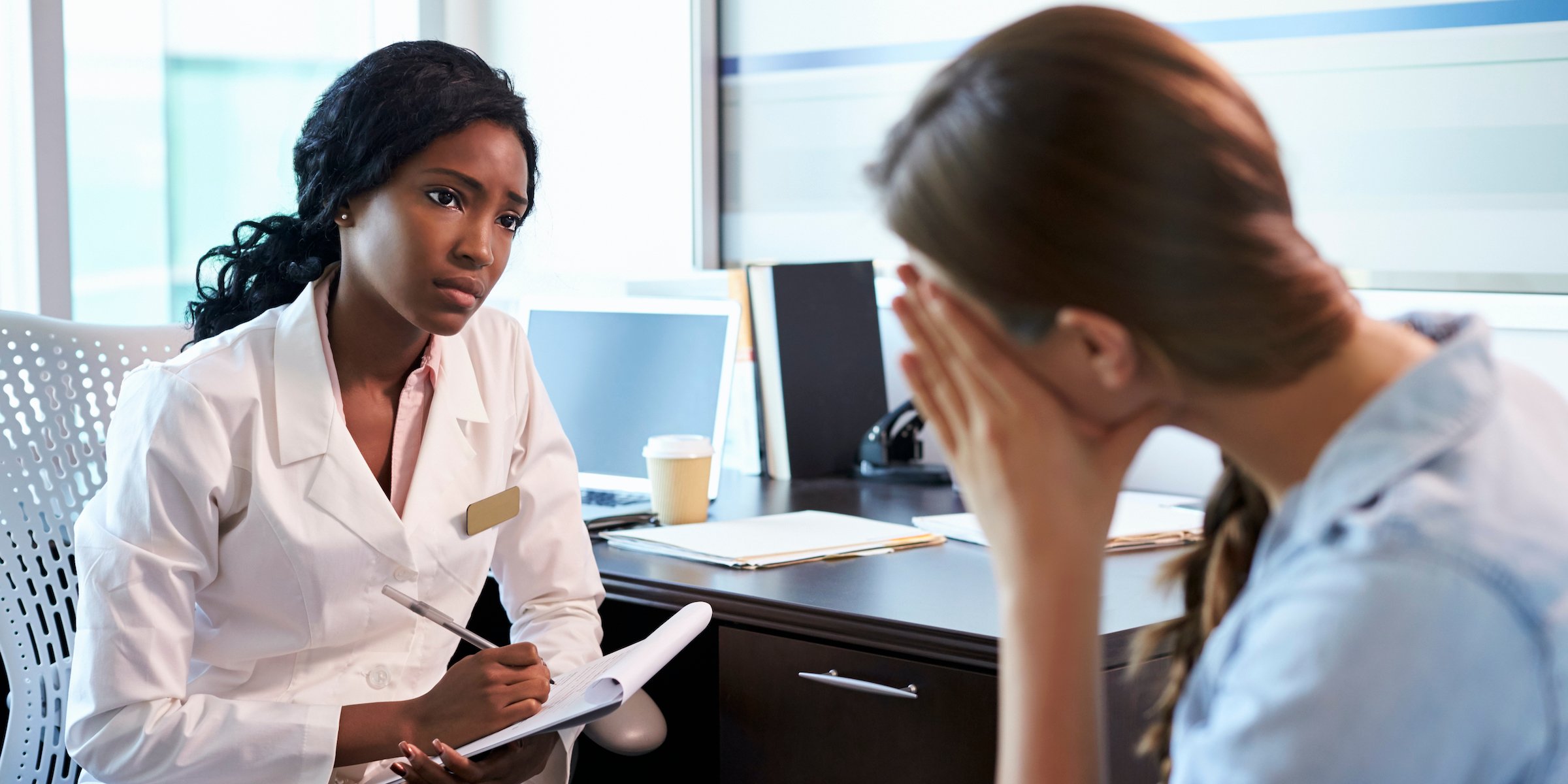 doctor in consultation with female patient